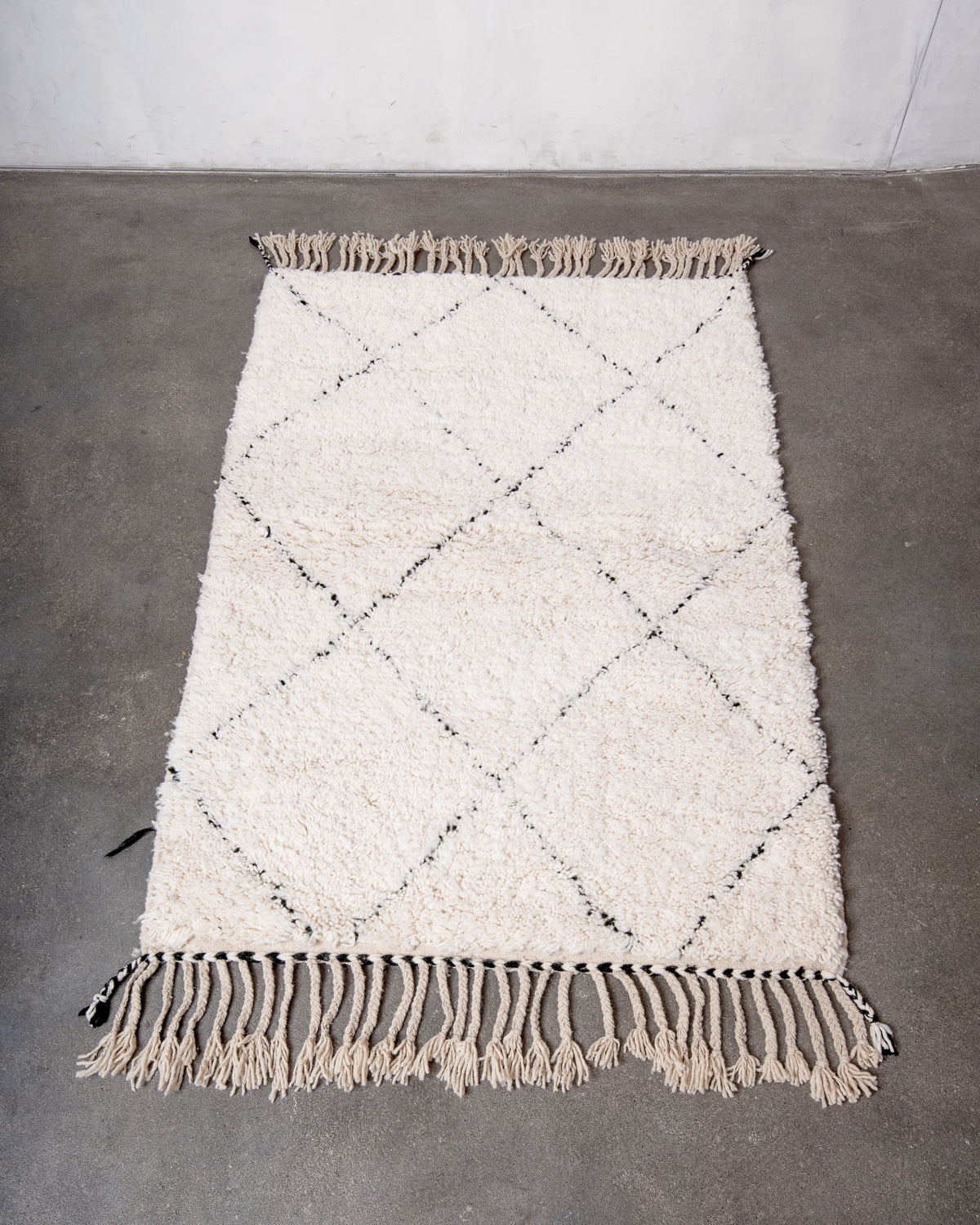 Modern, designer, handcrafted Berber rug from Morocco. Beniourain carpet with minimalist design, natural wool pile and a fluffy texture.